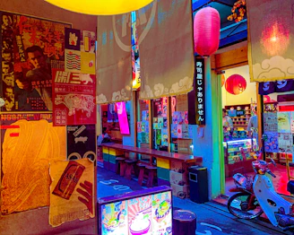 Colorful and eye-catching advertising posters displayed in a vibrant urban setting.