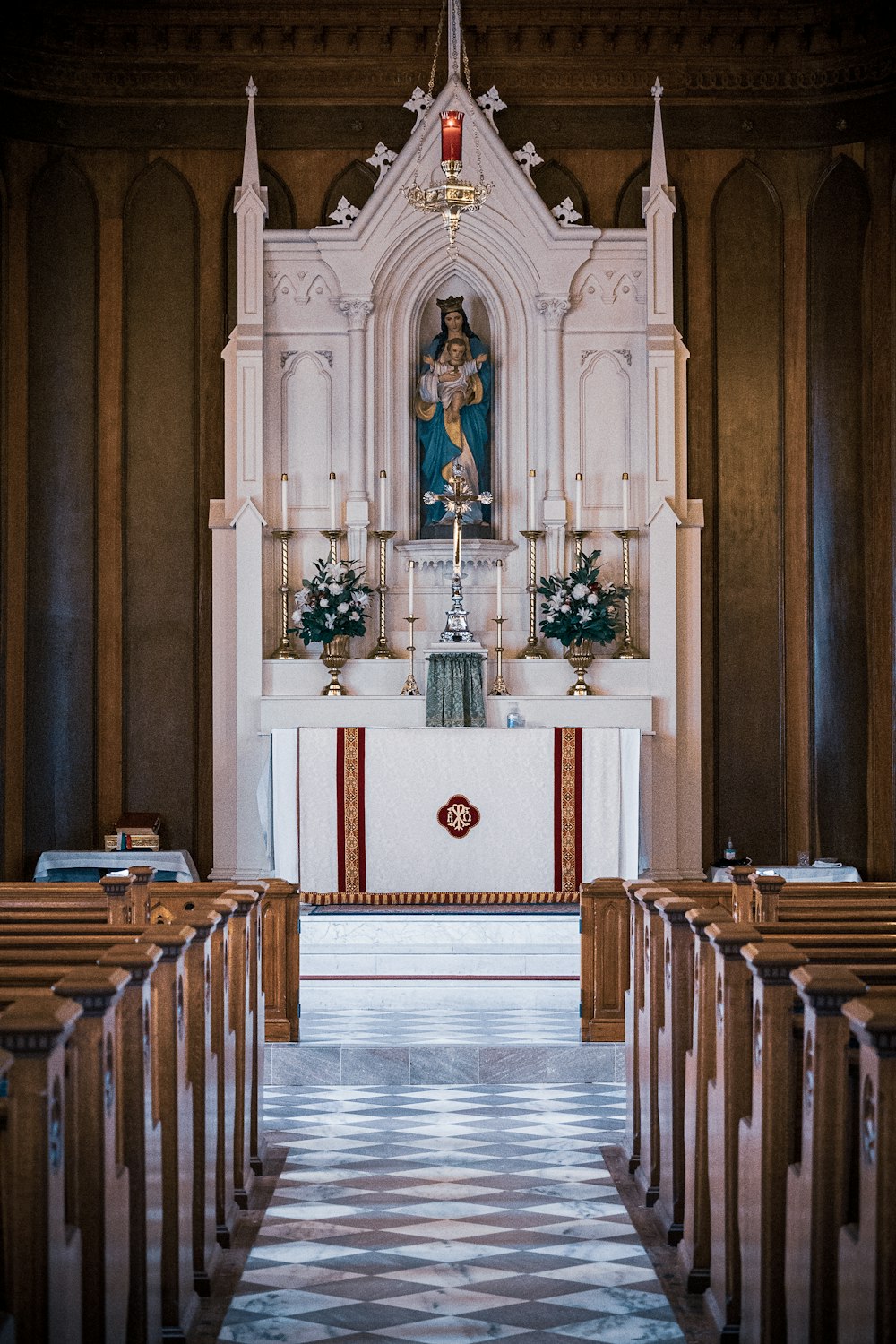 the interior of a church with pews and a alter