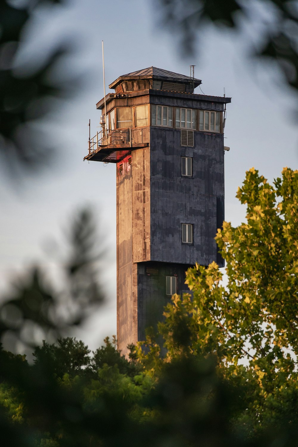 a tall tower with a clock on the top of it