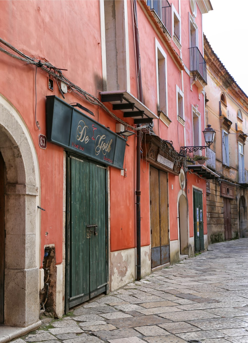 a row of buildings with a green door