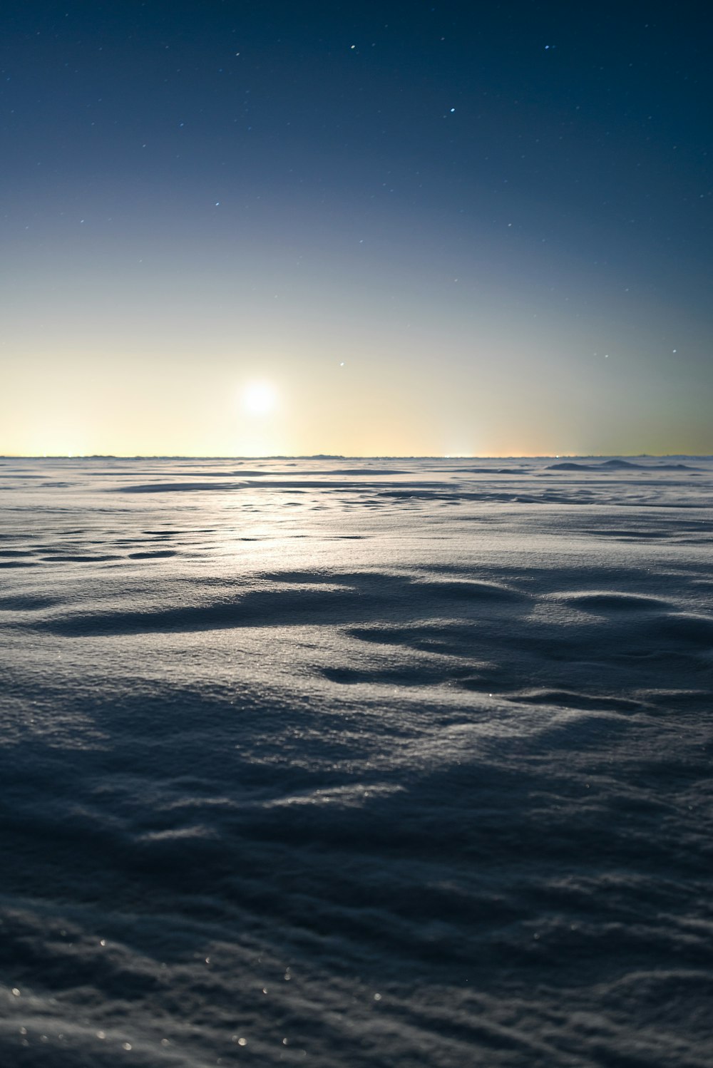 the sun is shining over the ocean water