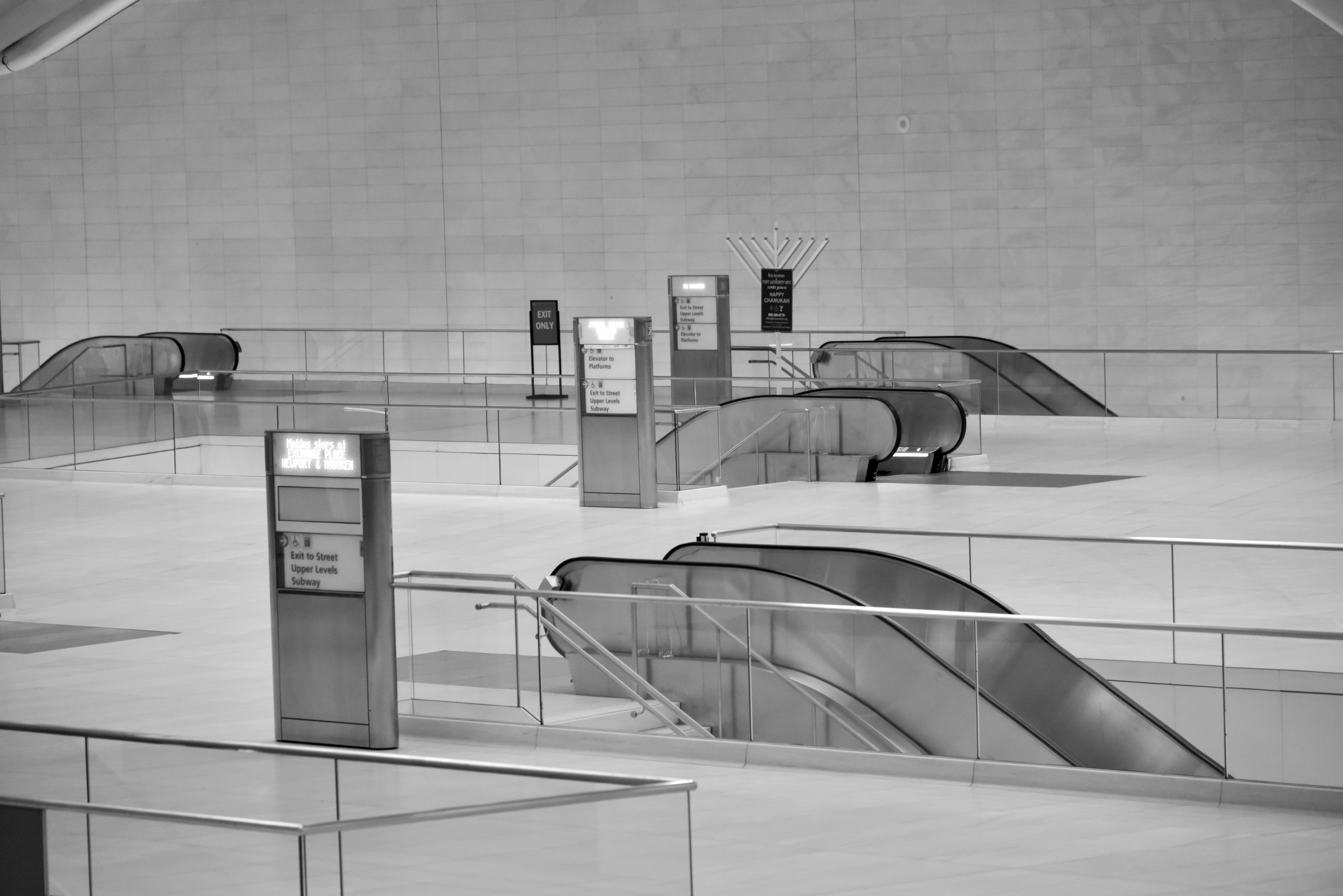 a black and white photo of a subway station