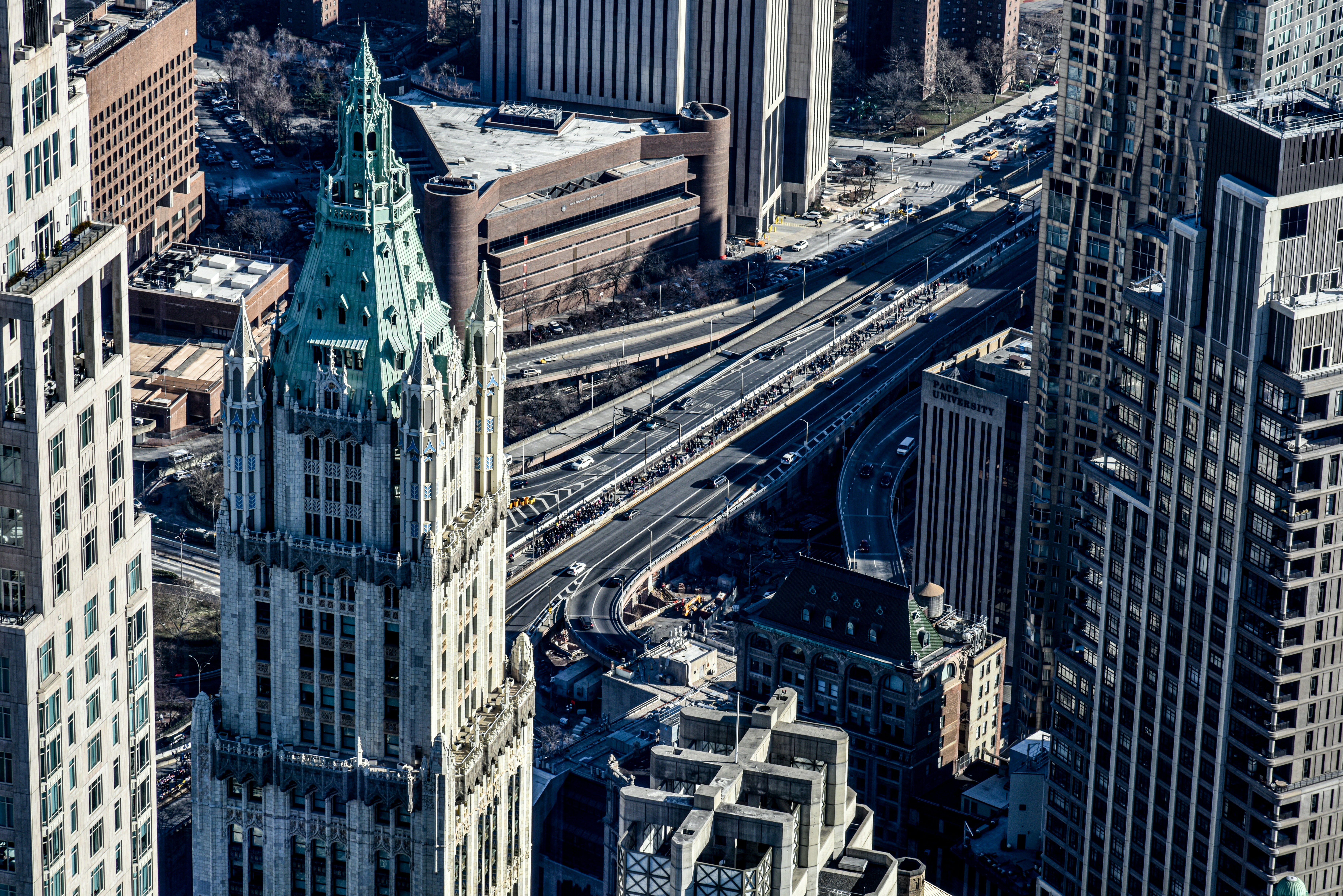 an aerial view of a city with tall buildings