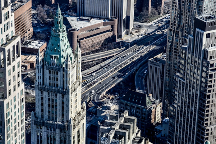 an aerial view of a city with tall buildings