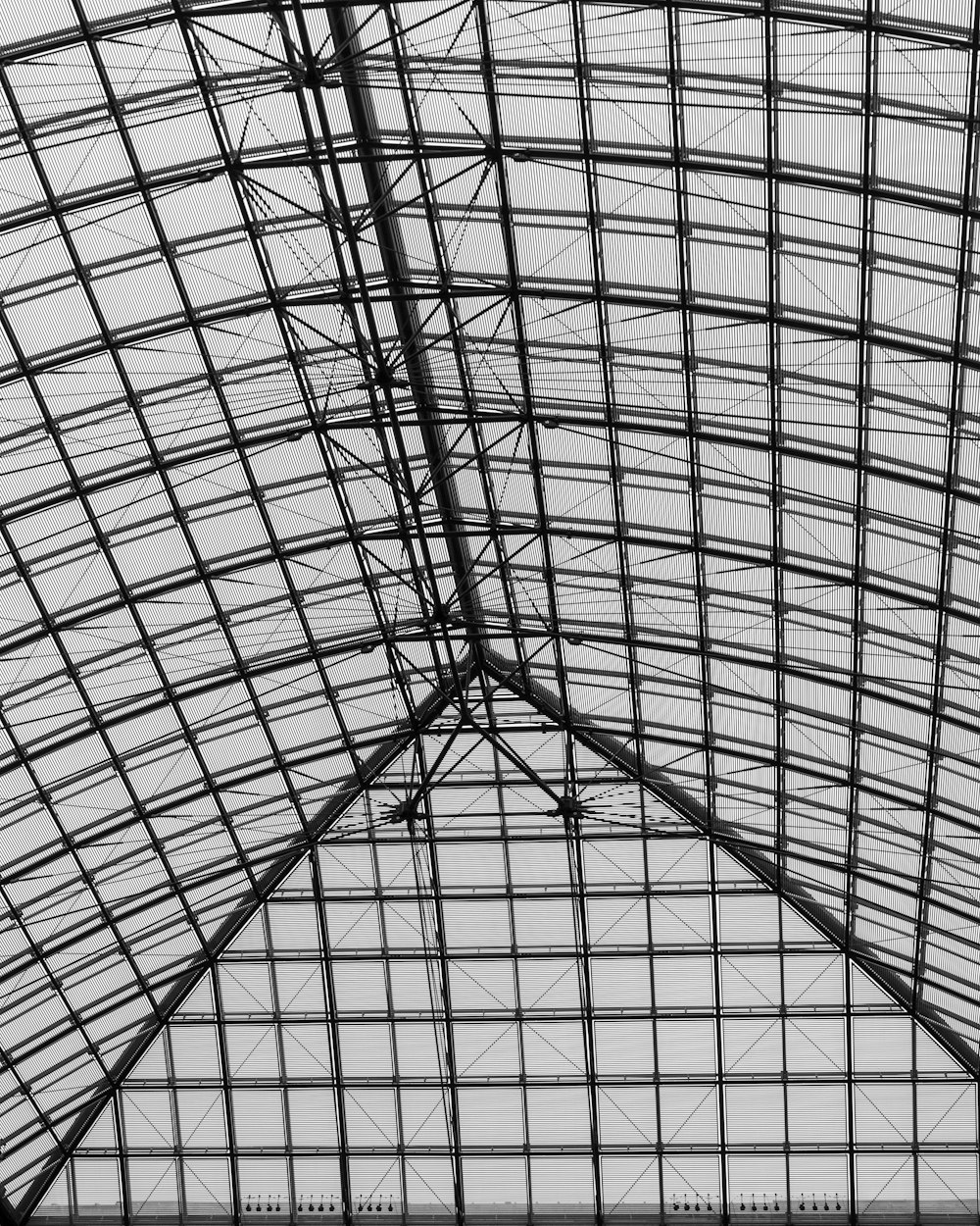 a view of the ceiling of a train station