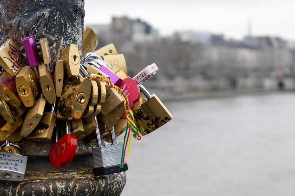 a bunch of locks attached to a pole