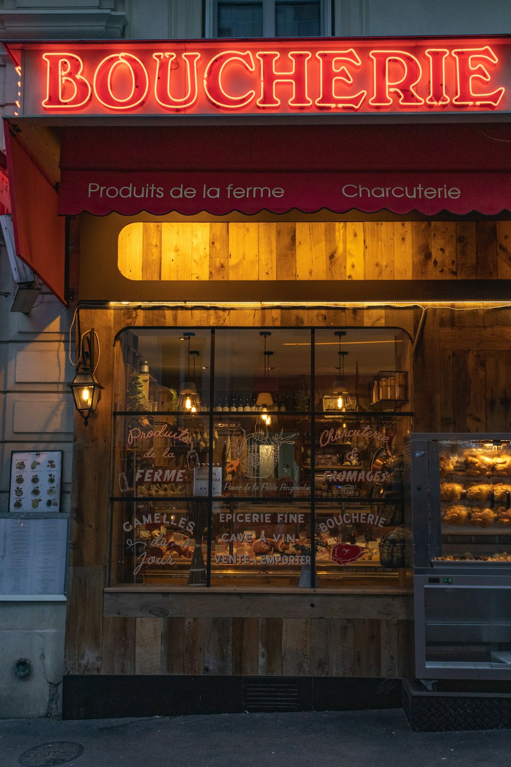 a store front with a lit up sign above it