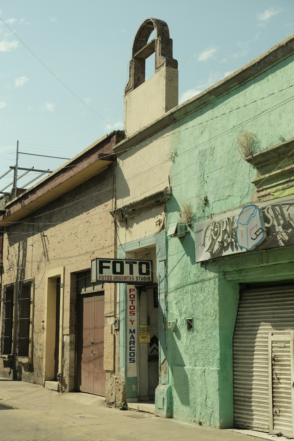 an old building with graffiti on the side of it