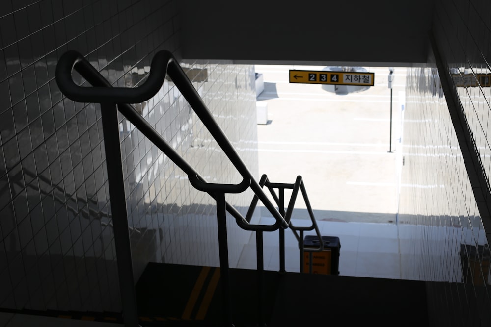 a view of a stairwell from the top of the stairs