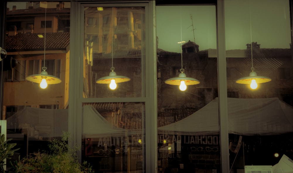 a group of lights hanging from the side of a building