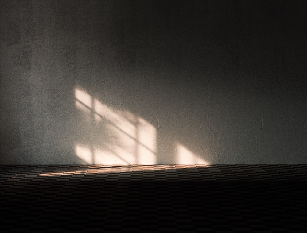 a shadow of a window on a wall