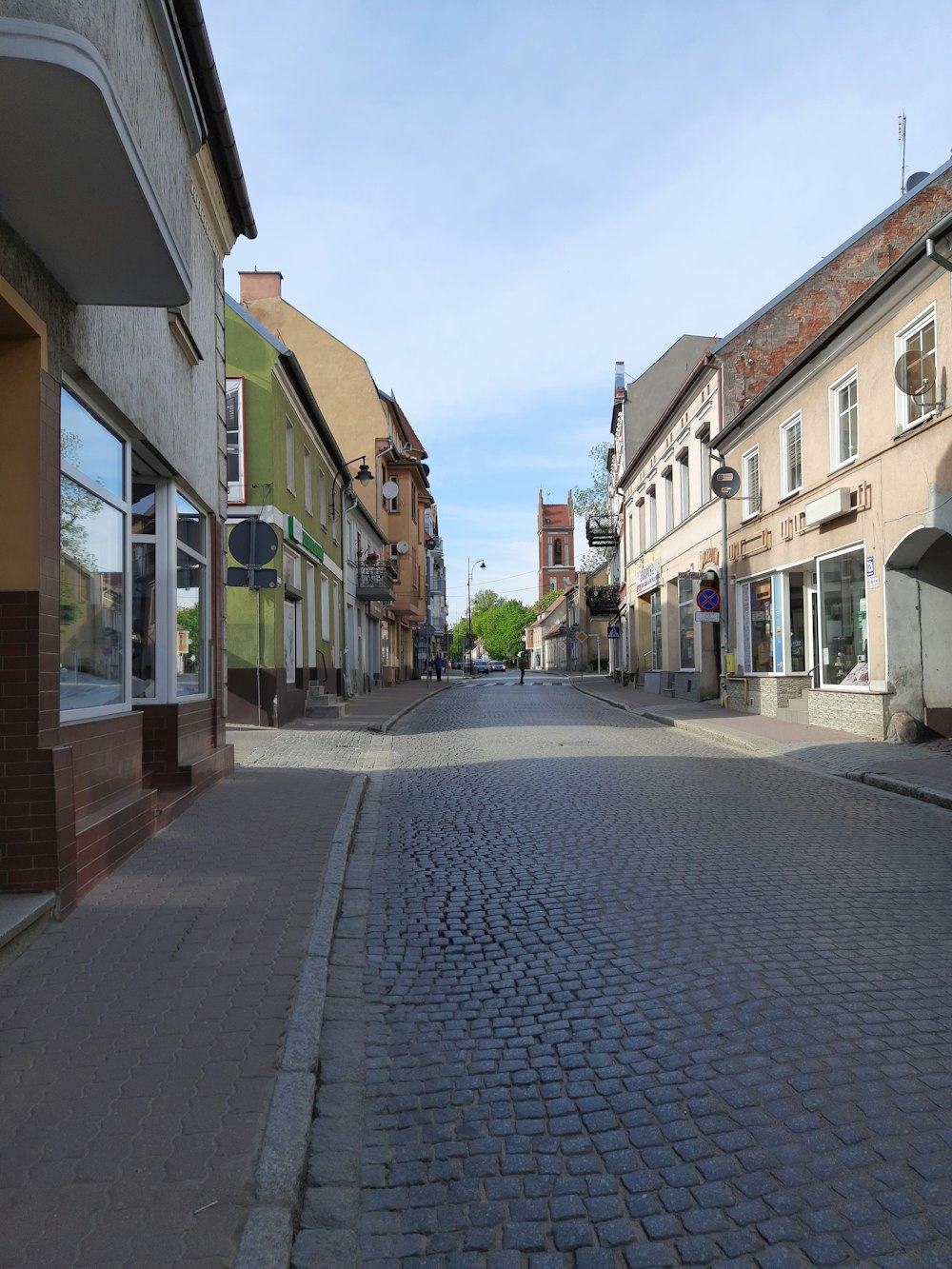 a cobblestone street in a small town