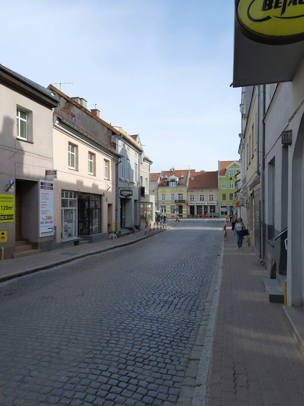 a cobblestone street in a small town