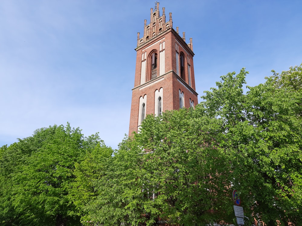 a tall tower with a clock on the top of it