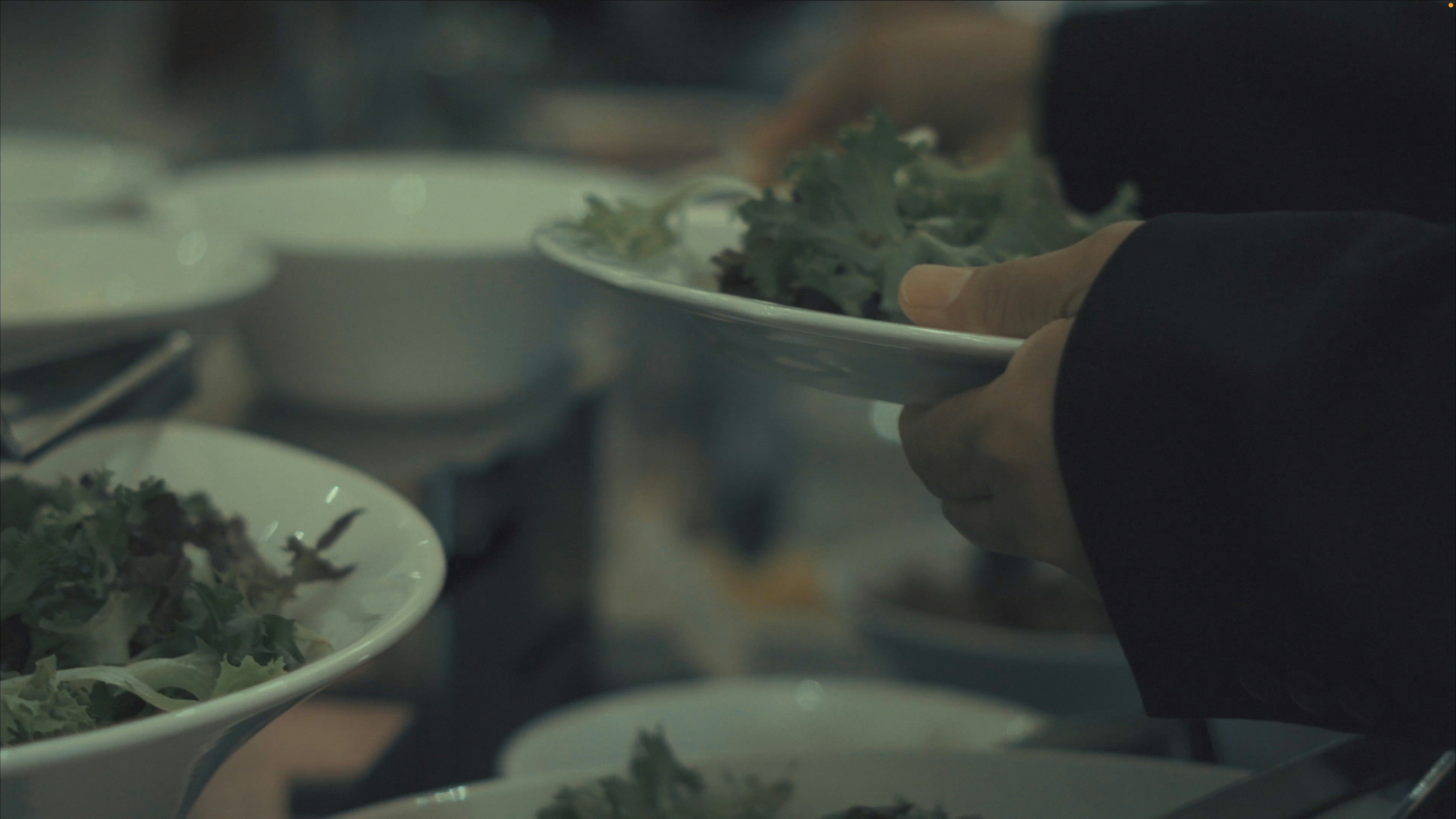 a close up of a person holding a plate of food