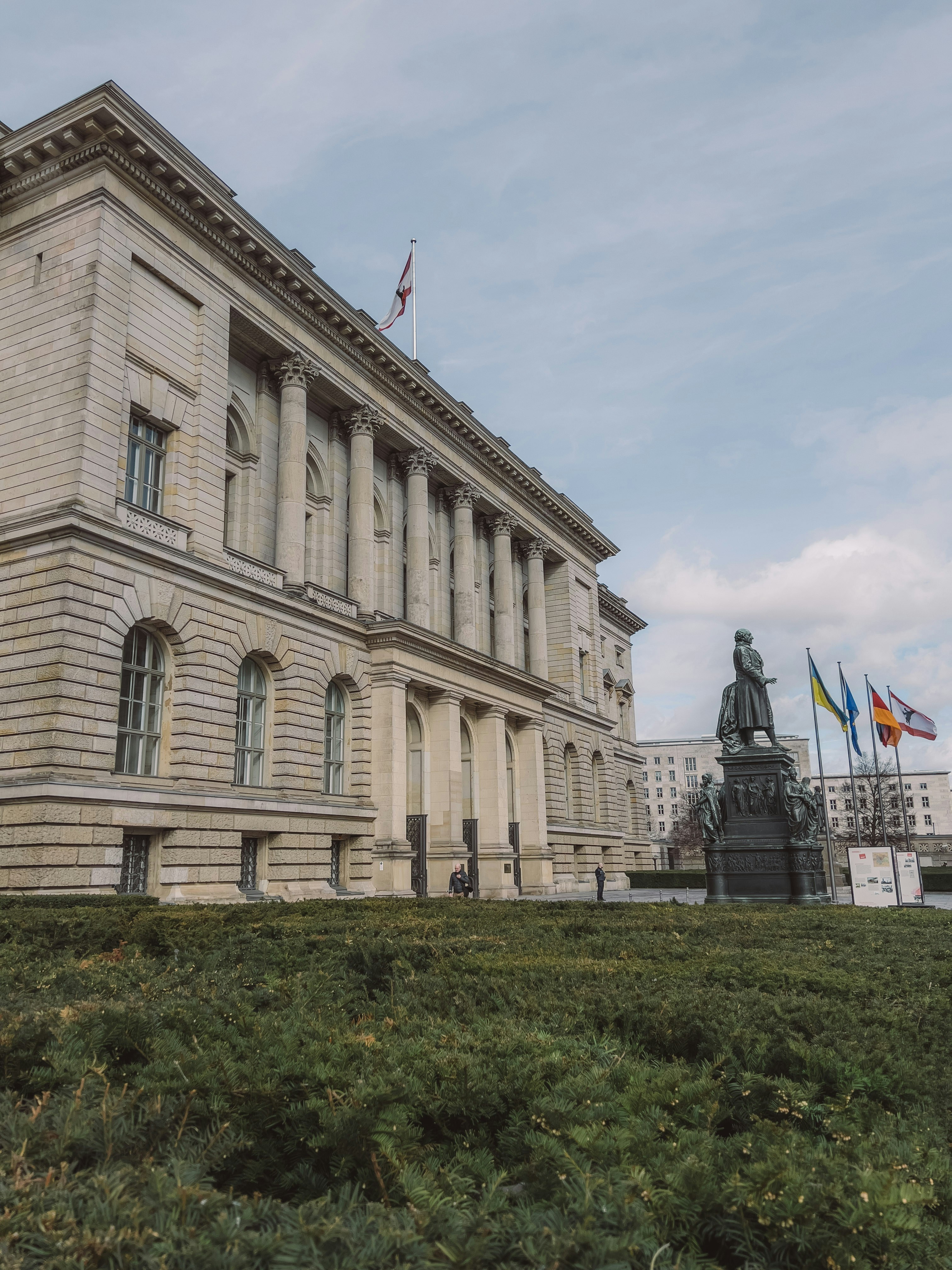 a large building with a statue in front of it