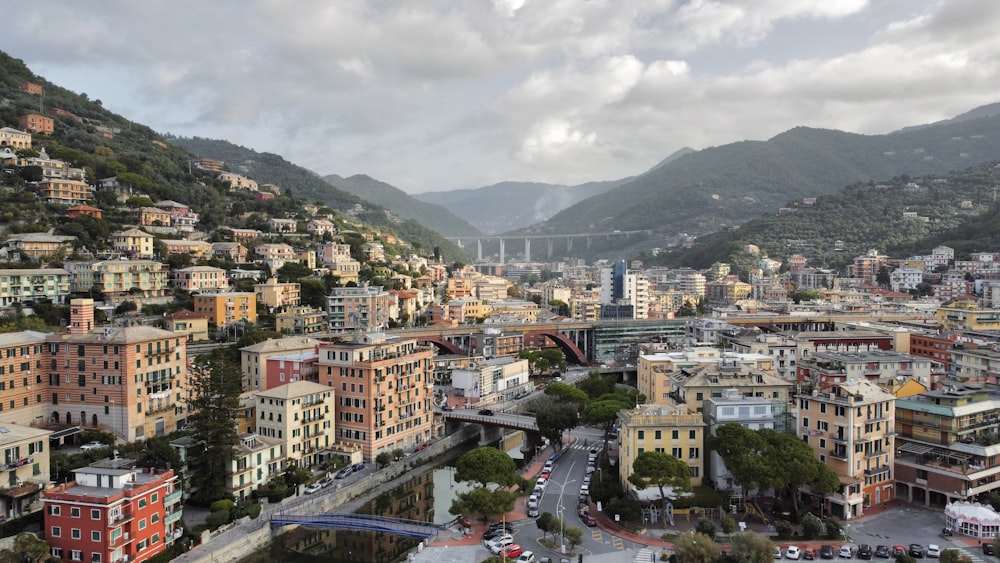 a view of a city with mountains in the background