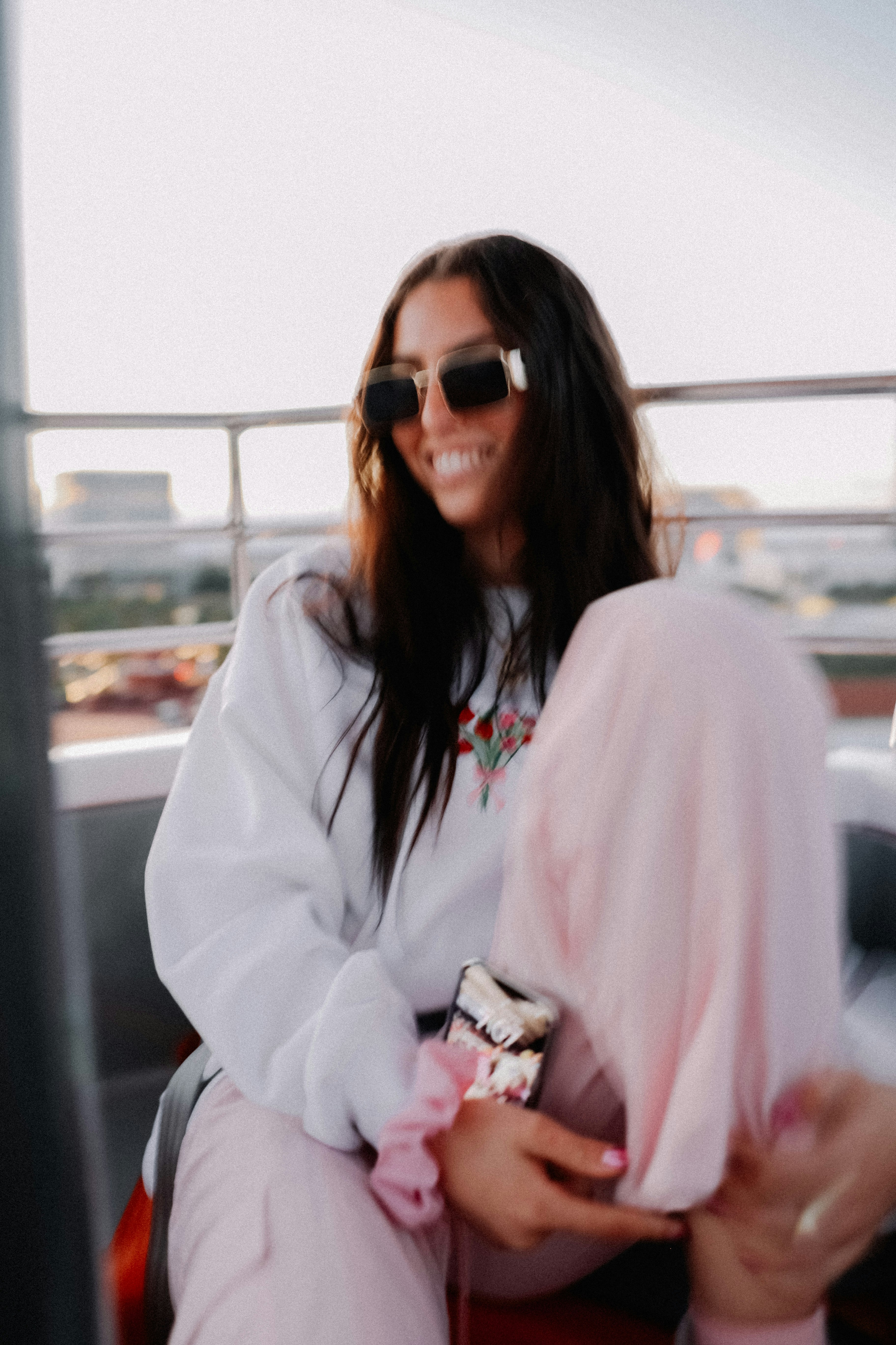 a woman sitting on the back of a truck