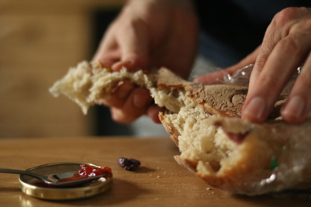 a close up of a person eating a sandwich