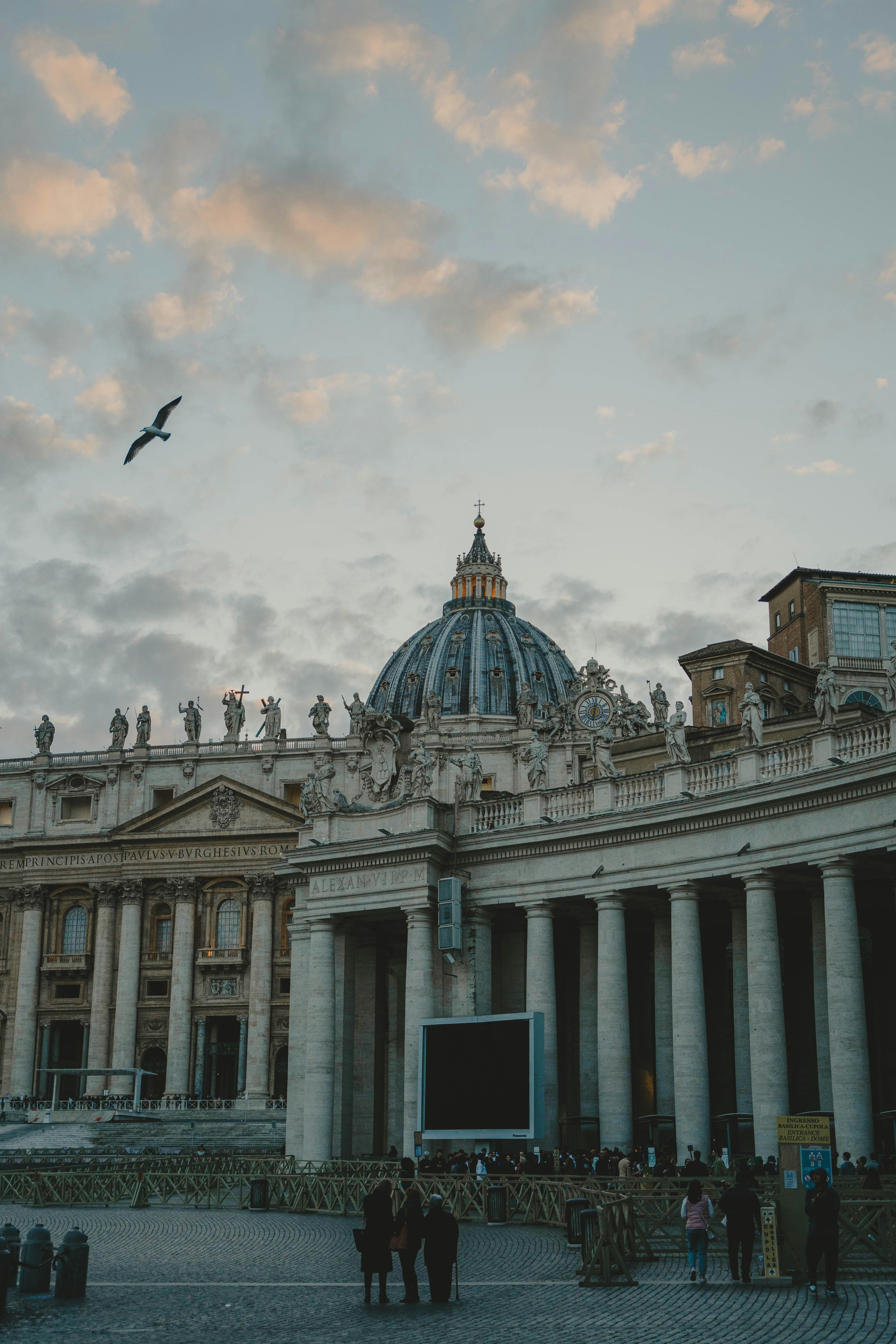 a group of people standing in front of a building