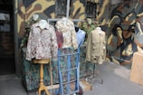 A stylish apparel display featuring tactical-themed clothing.