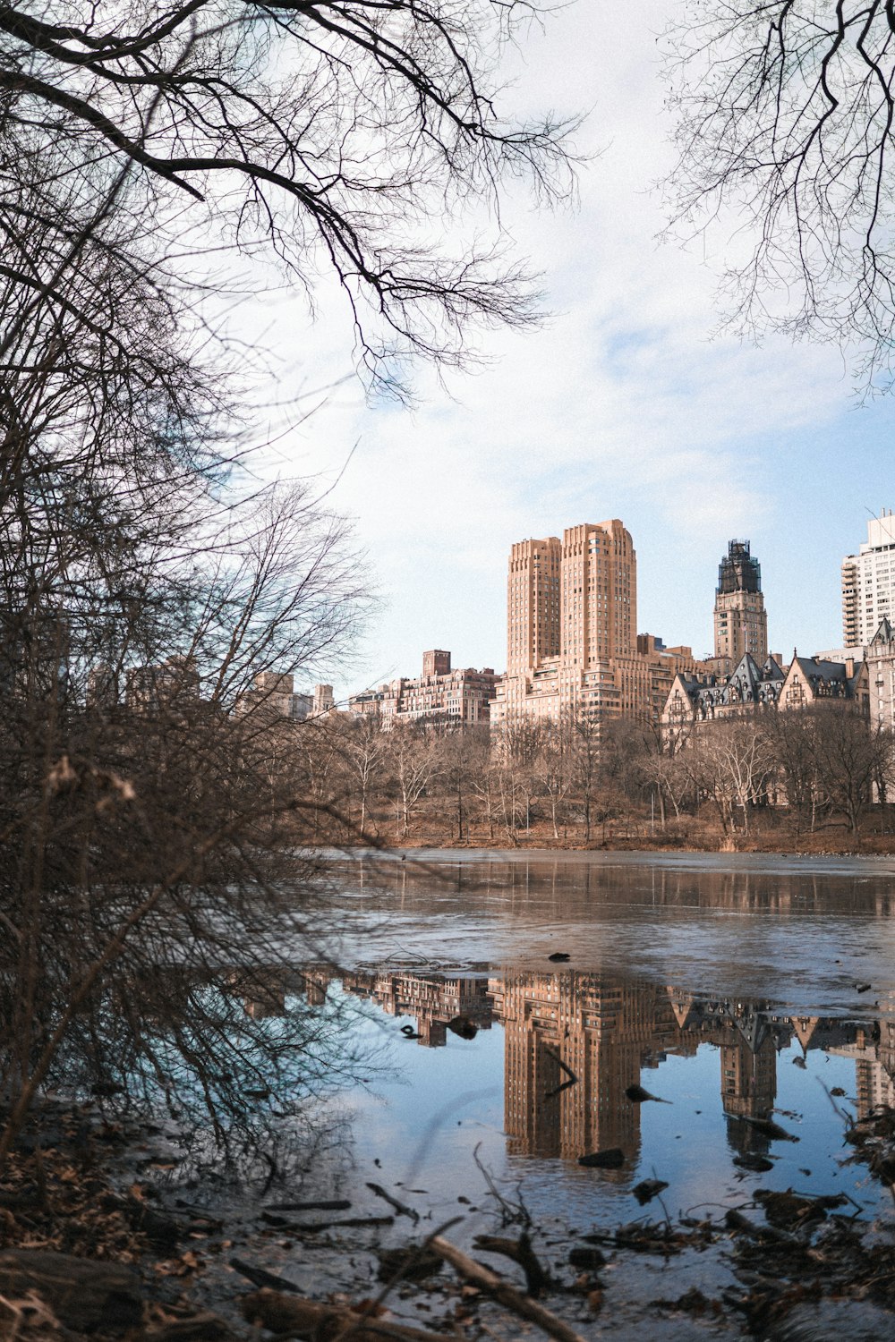 a body of water surrounded by tall buildings