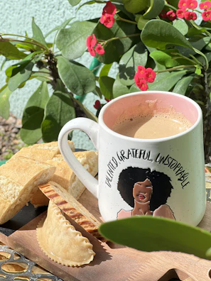 Close-up of a vibrant mug featuring a cheeky, playful quote on a bright background.