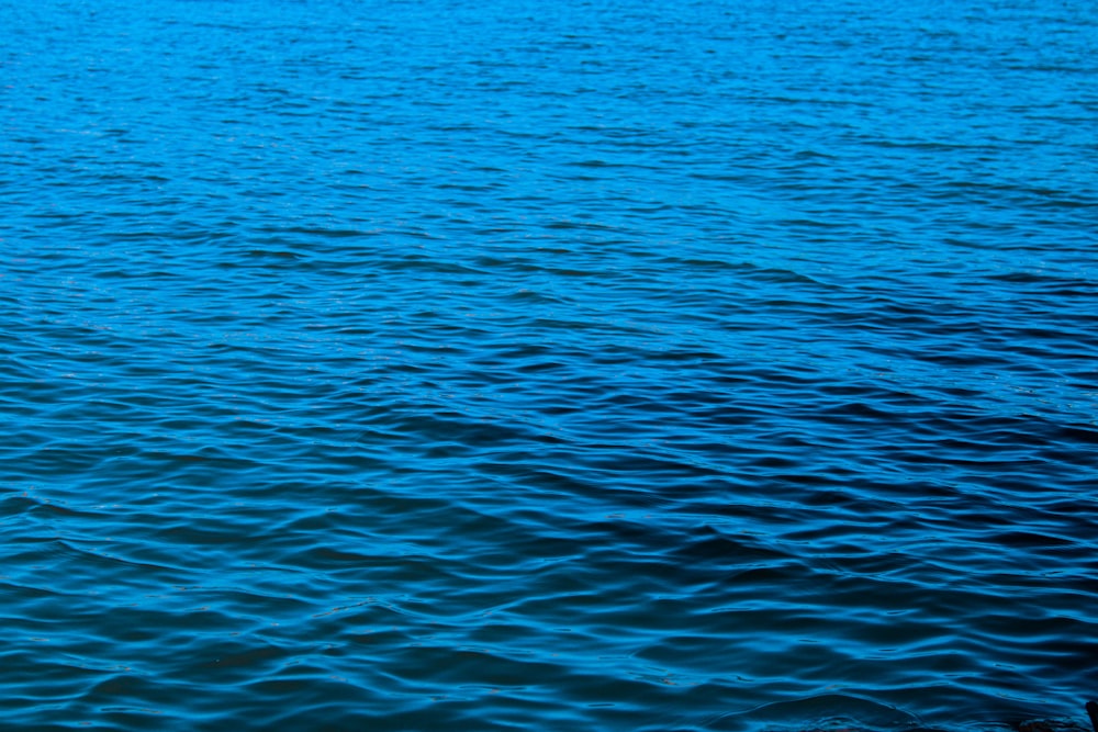 a boat floating on top of a large body of water