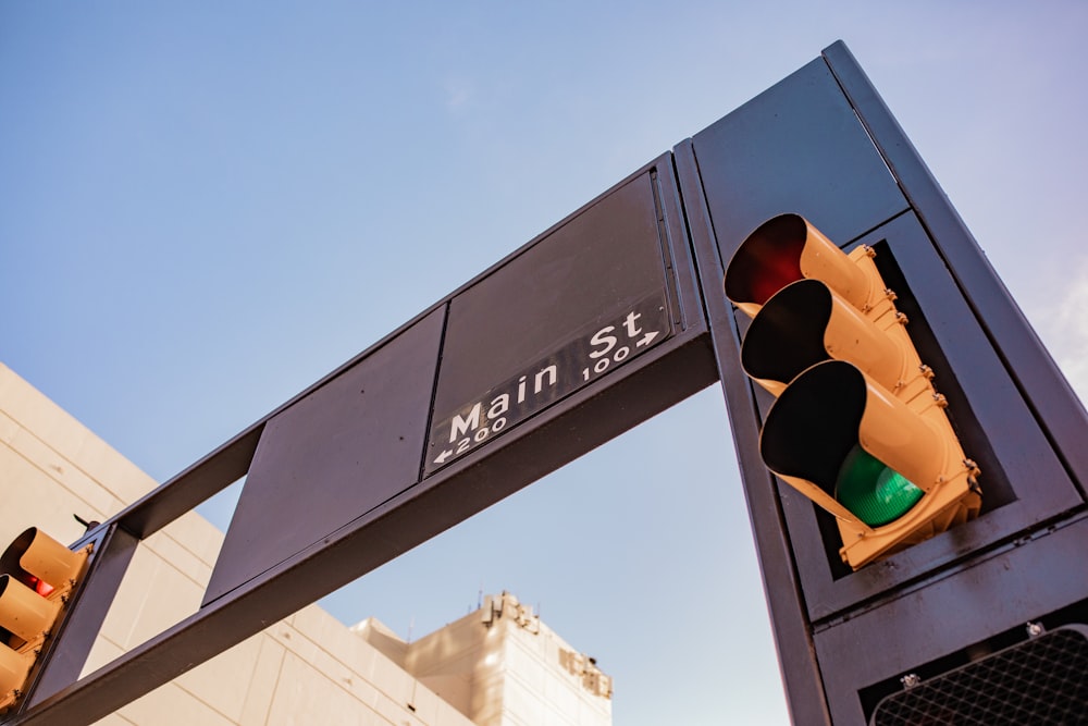 a traffic light sitting next to a tall building