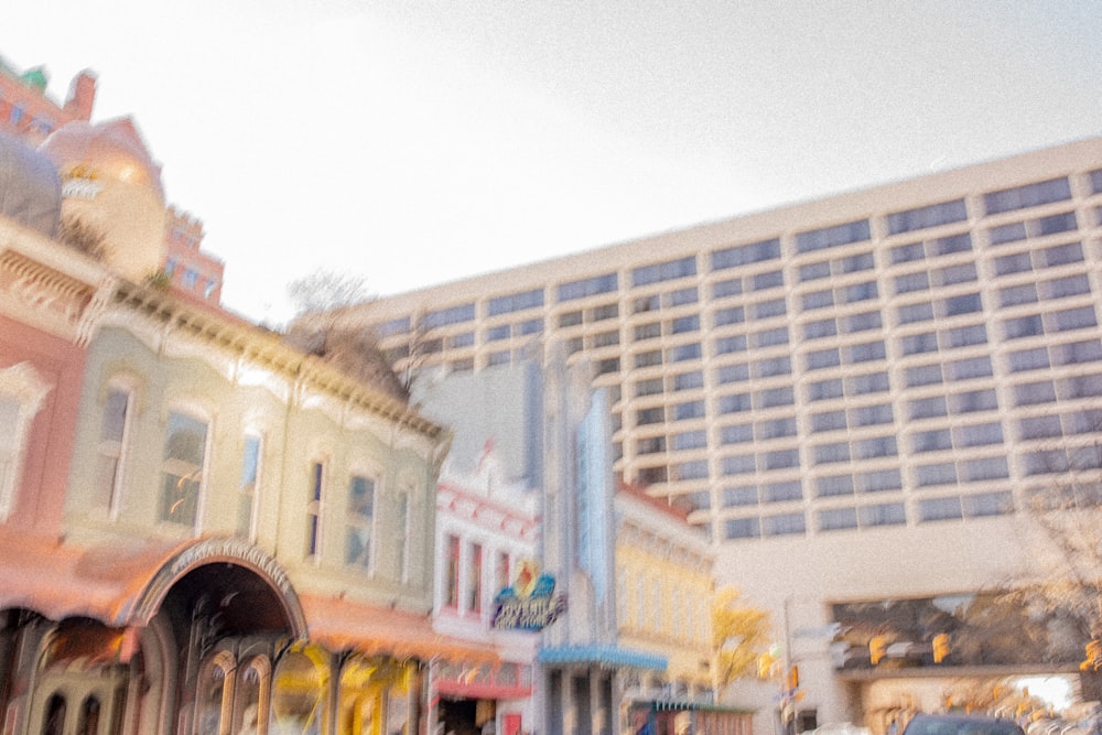 a blurry photo of a city street with a building in the background