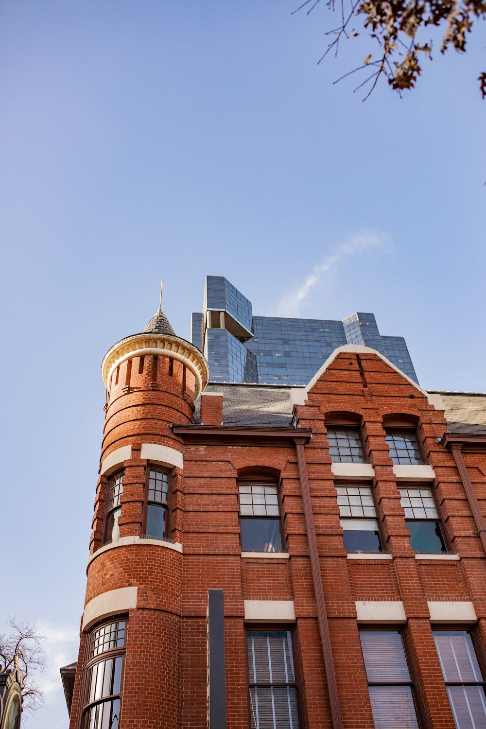 a tall red brick building with a clock tower