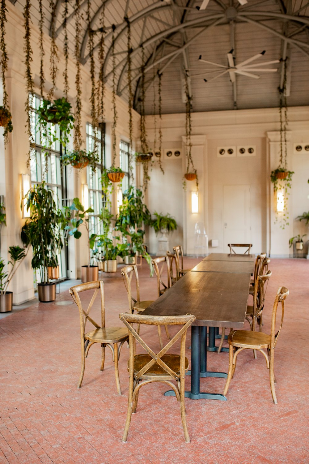 a dining room with a long table and chairs