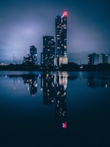 A nighttime cityscape with deep royal blue lights, reflecting ambition and high-value lifestyle.