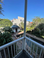 View of the peaceful courtyard from a room window at Srirangam Stays.