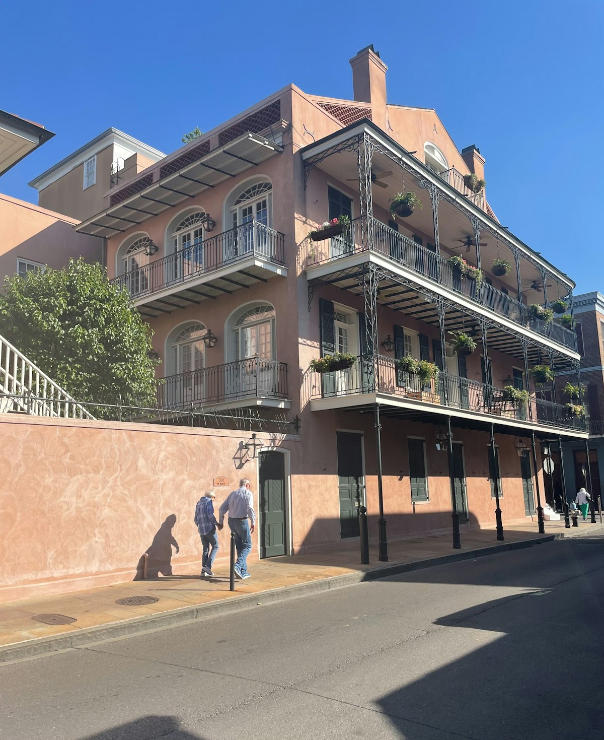 New Orleans French Quarter — wrought-iron balconies draped in Mardi Gras beads over Royal Street