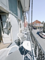 Balcony view overlooking a quiet street, perfect for morning coffee.
