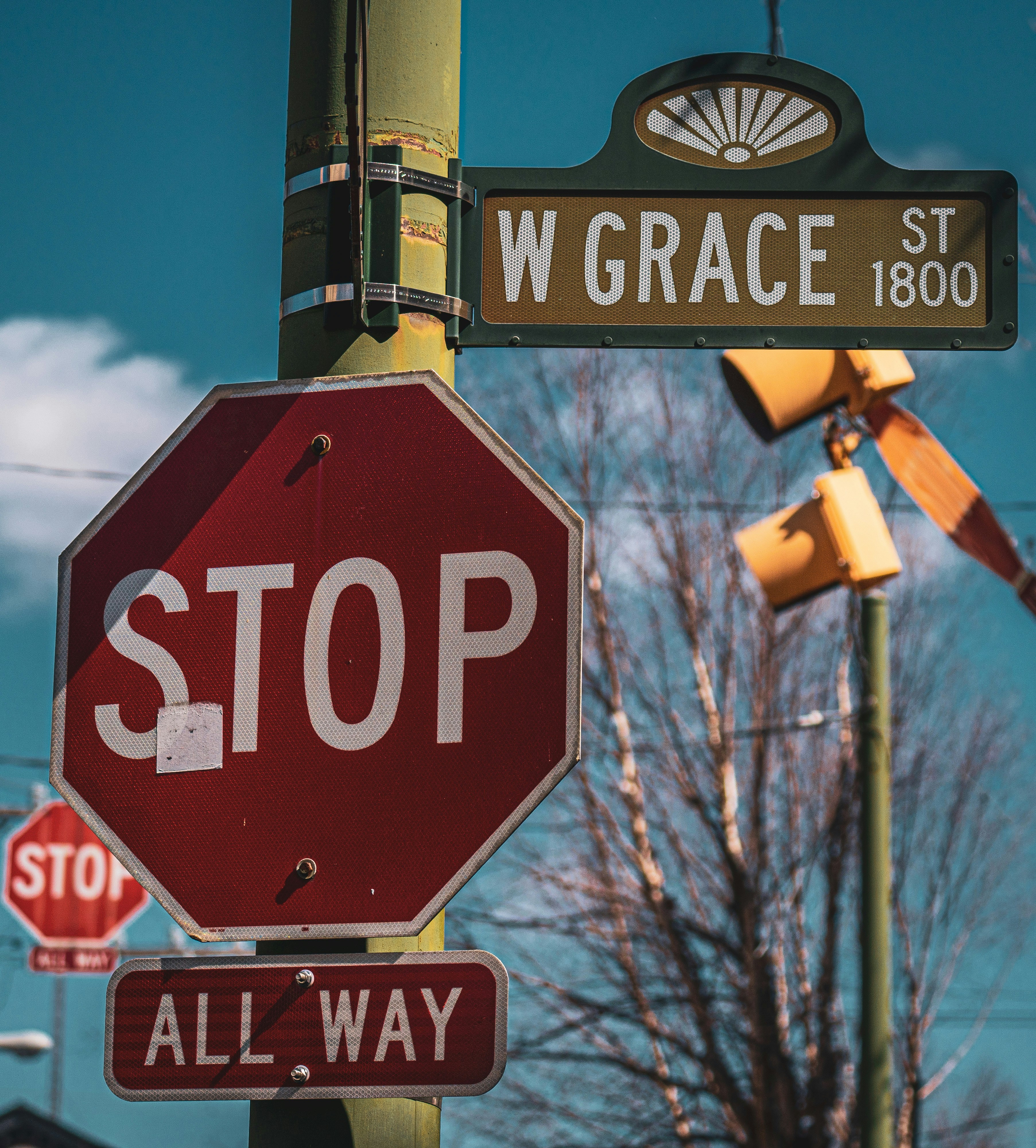 a stop sign with a street sign above it