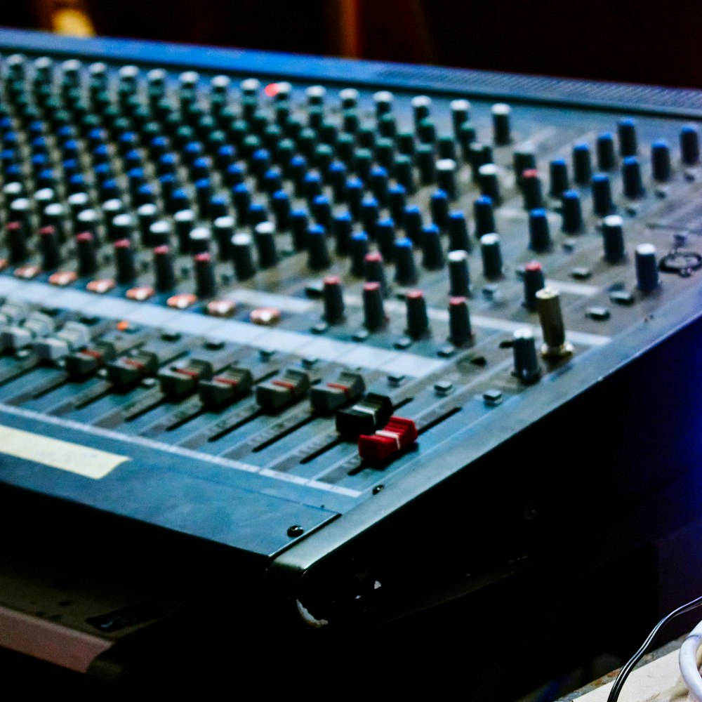 a close up of a sound mixing console