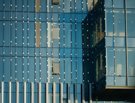 Close-up of modern building facade with horizontal lines and glass windows