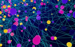 a large group of colorful balls floating in the air