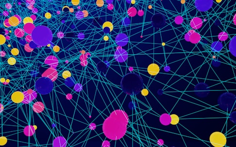 a large group of colorful balls floating in the air