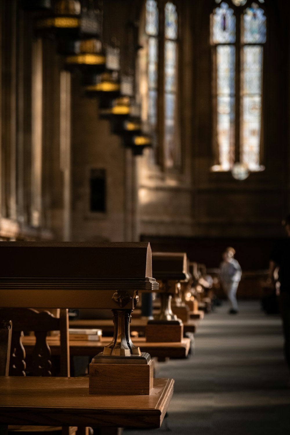 a church filled with wooden pews and tall windows