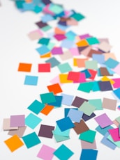 a white table topped with lots of colorful confetti