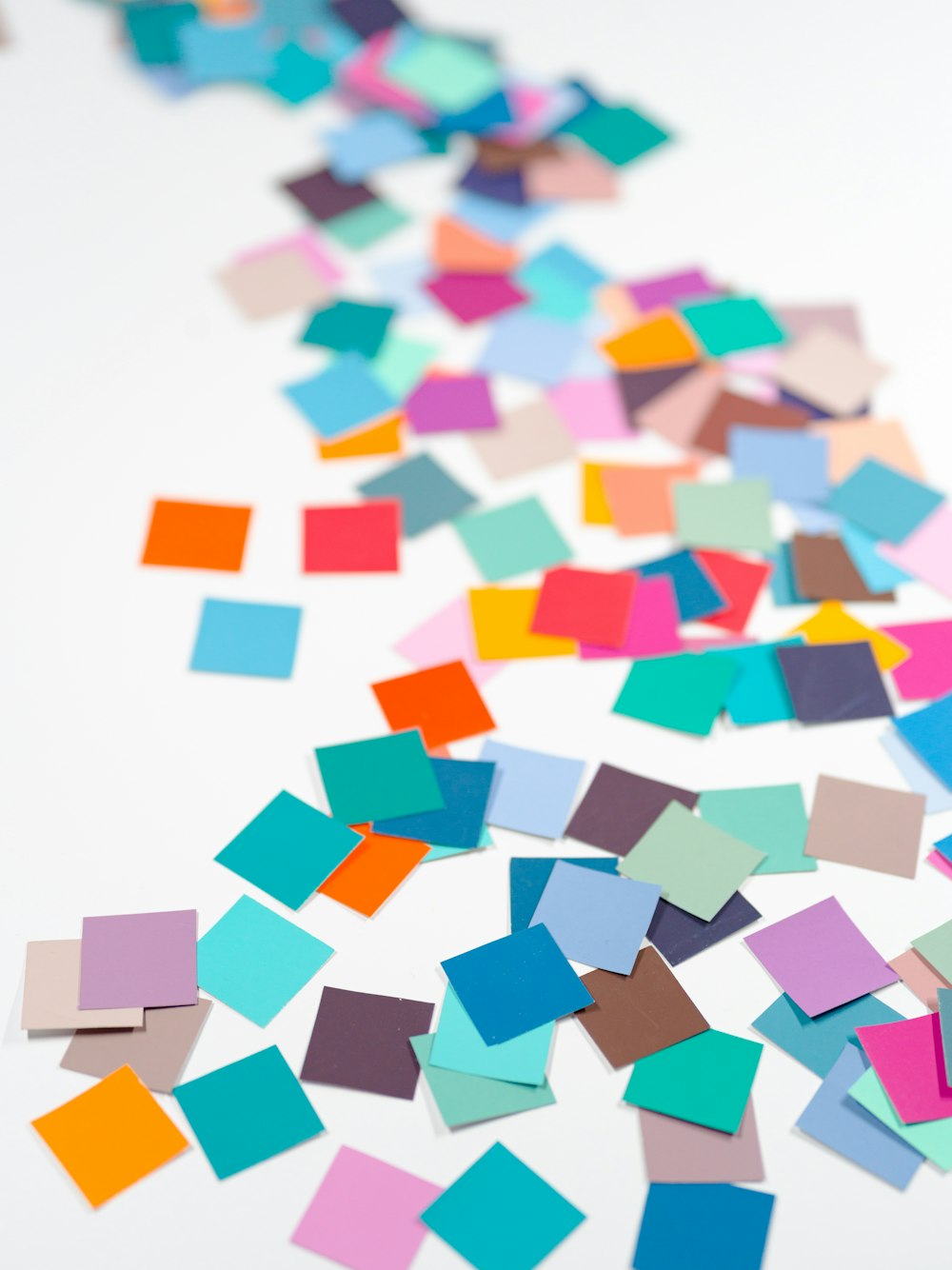 a white table topped with lots of colorful confetti