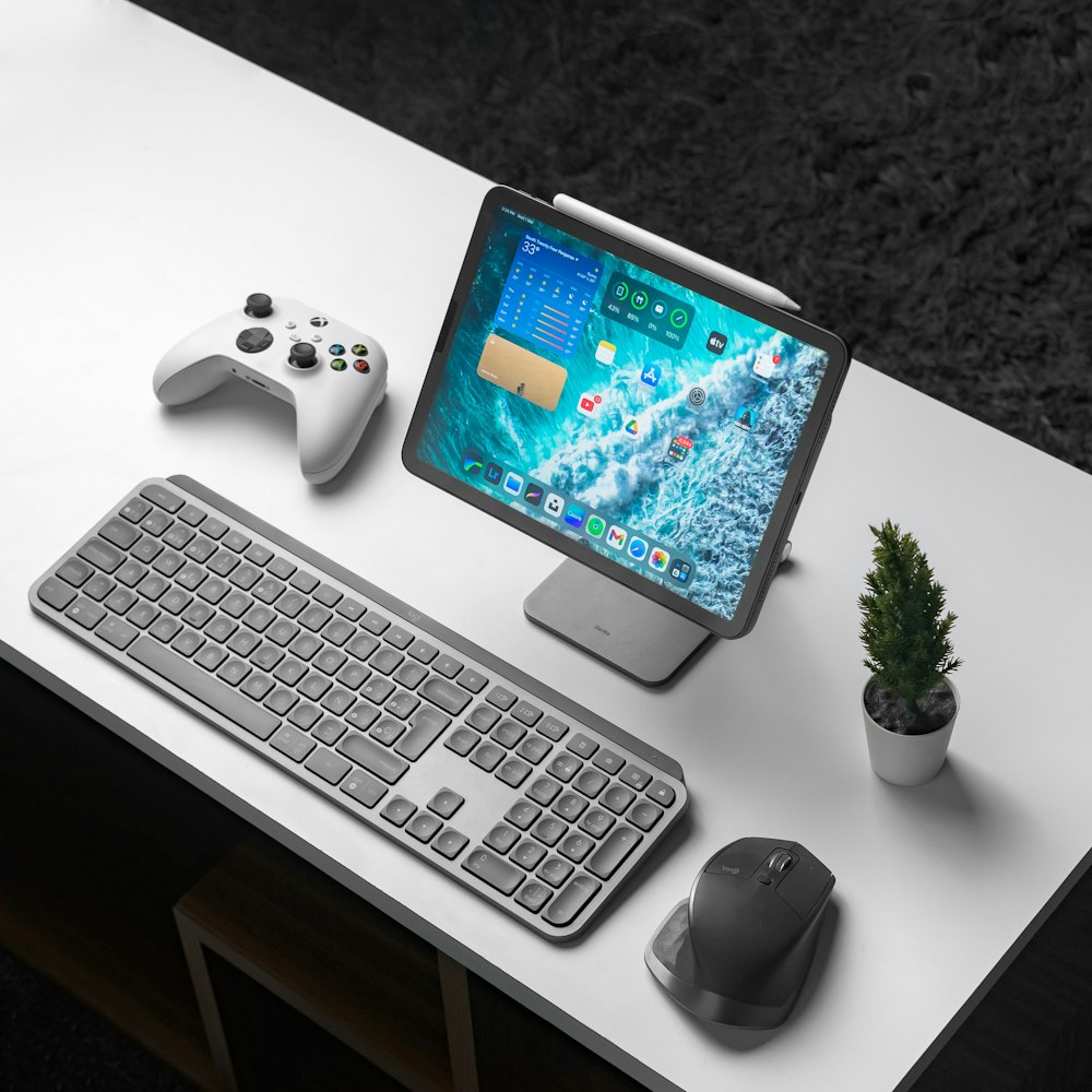 a desk with a keyboard, mouse, and monitor