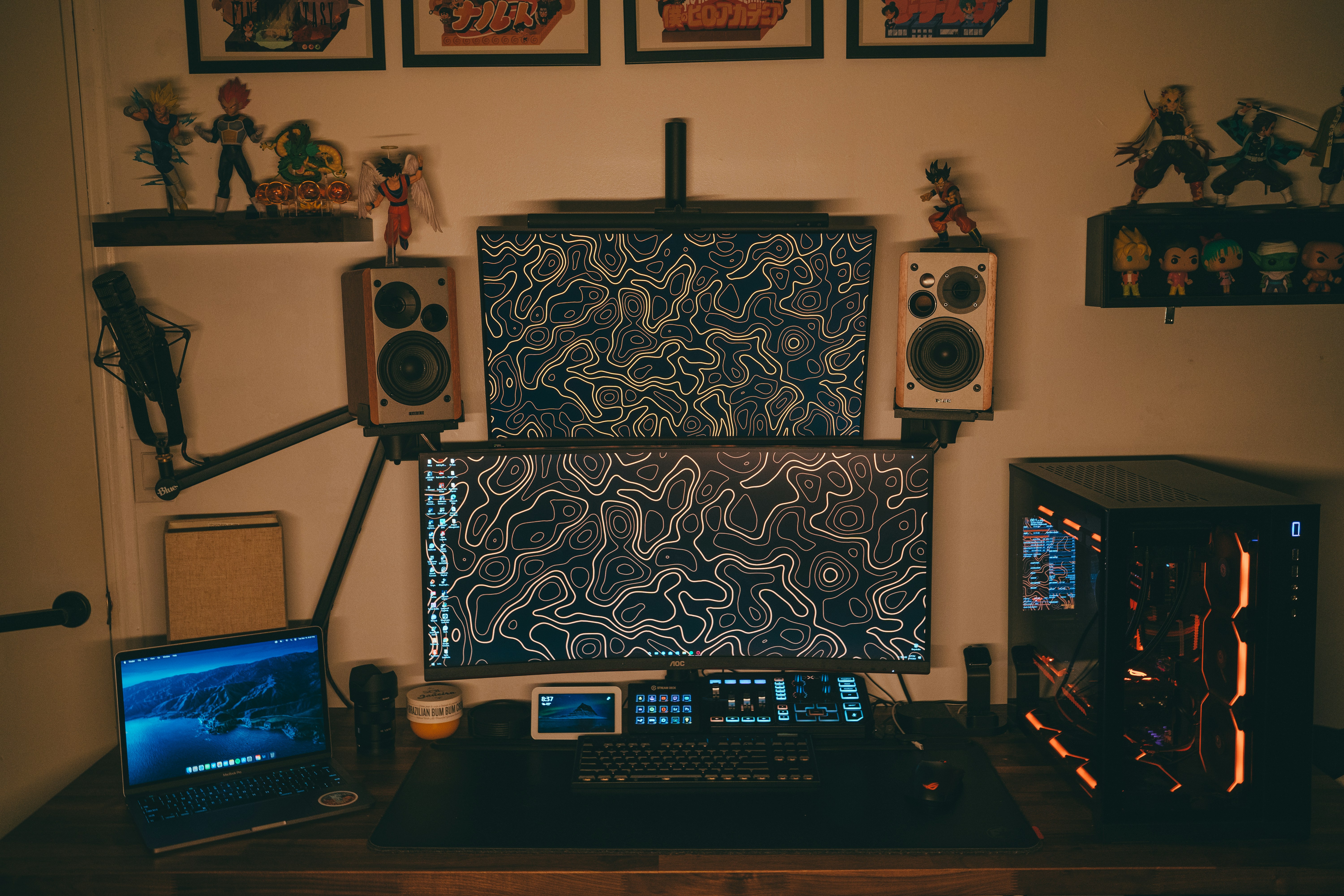 Computer desk with laptop and speakers