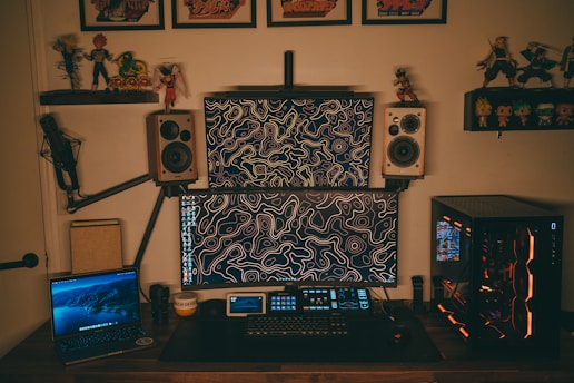 A cozy desk setup with gaming memorabilia and movie posters in the background.