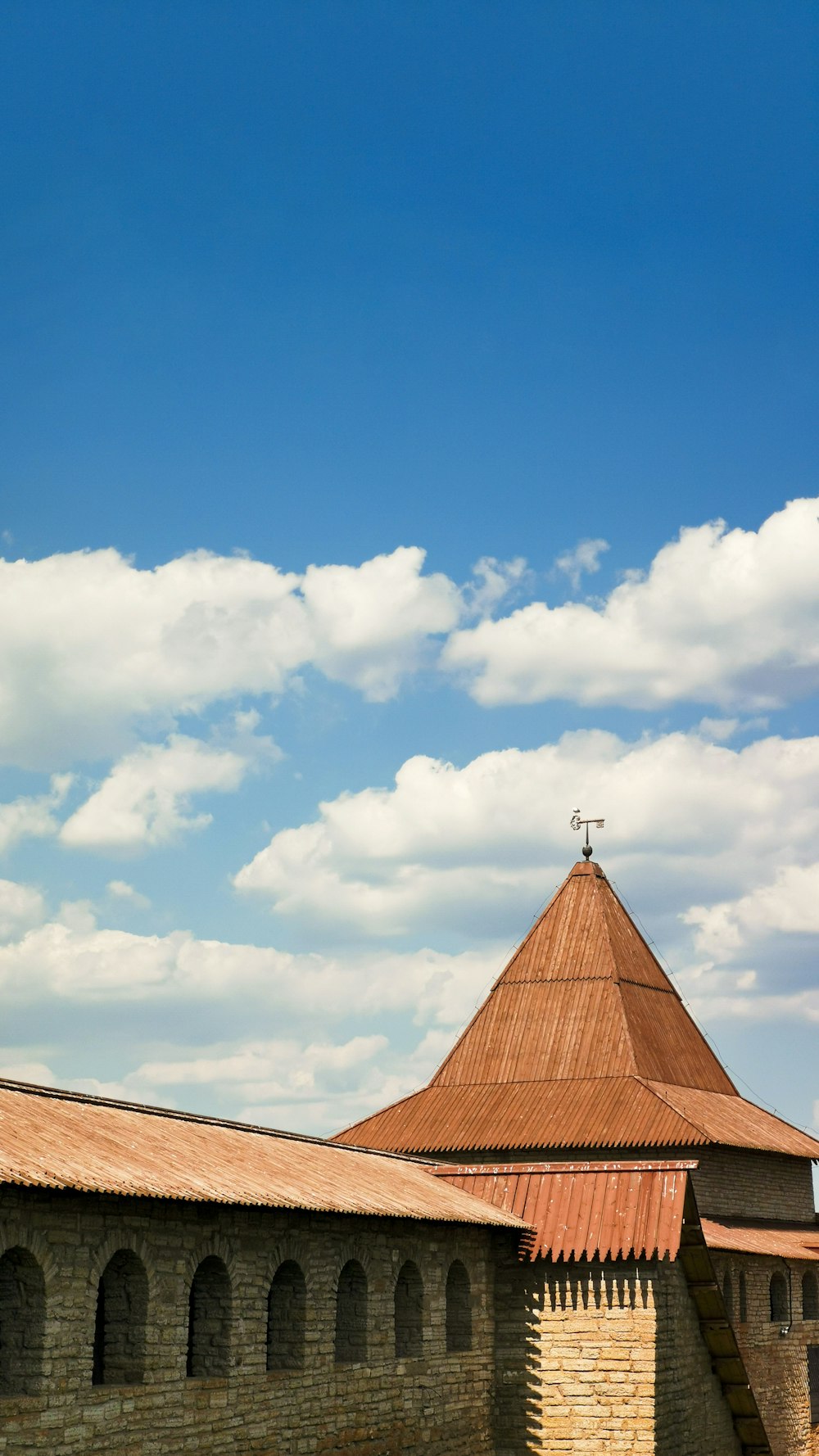 a building with a tower and a cross on top