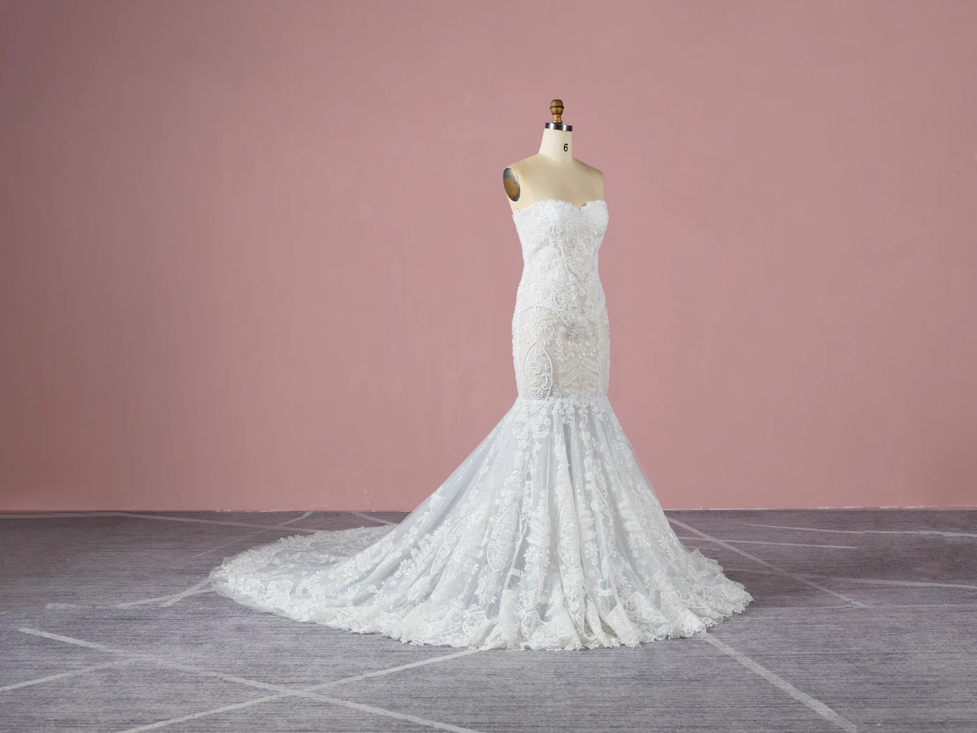How to style a pearl bridal belt with a mermaid gown — A close-up of a pearl bridal belt cinching the waist of a mermaid wedding gown