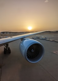 Aerial view of an airplane being refueled at a coastal airport in Maranhão during sunset.